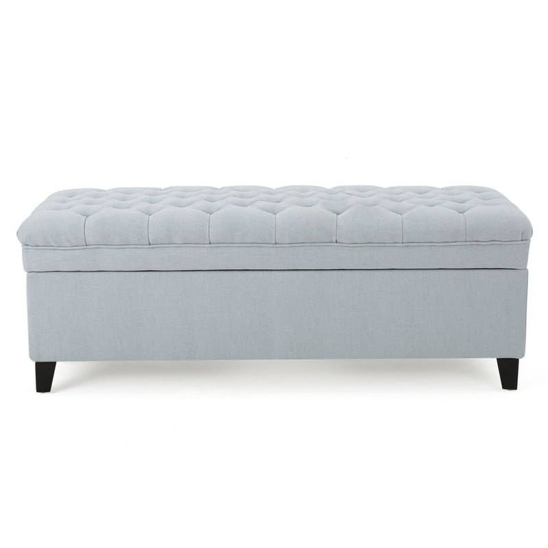 Noble House Juliana storage ottoman with birch wood legs and plush fabric, offering stylish seating and hidden storage.