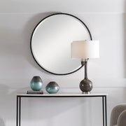 Black round wall mirror by Uttermost, featuring a sleek frame and reflective glass, perfect for modern home decor.