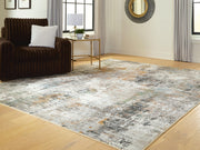 Signature Design by Ashley Torinette area rug with intricate pattern and soft texture, ideal for living rooms and bedrooms.