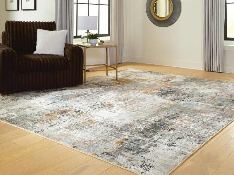 Signature Design by Ashley Torinette area rug with intricate pattern and soft texture, ideal for living rooms and bedrooms.
