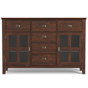 Handcrafted Simpli-Home Artisan sideboard buffet with wooden finish, featuring multiple storage drawers and cabinets.