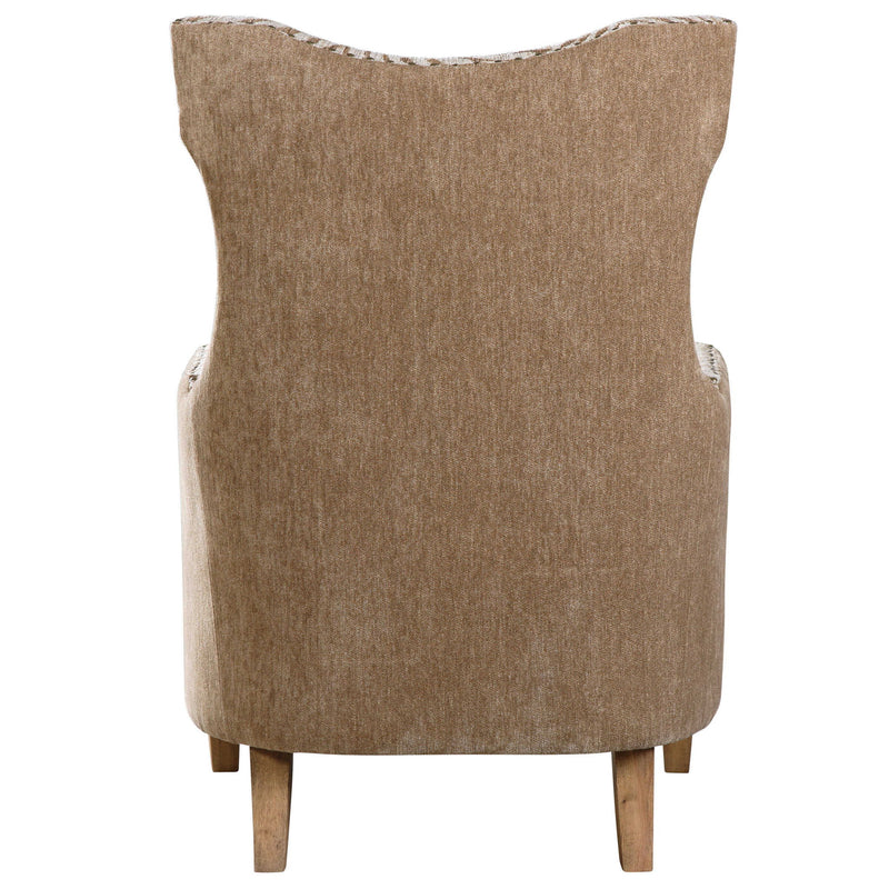 Light brown Kiango animal pattern armchair by Uttermost with plush upholstery and curved wooden legs.