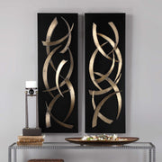 Pair of black metal wall art pieces from Uttermost's Brushstrokes decor set, featuring abstract, textured designs for modern wall decoration.