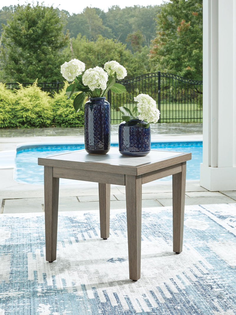 Signature Design by Ashley Rainier Ranch square end table in brown and beige wood finish, showcasing a modern square design.