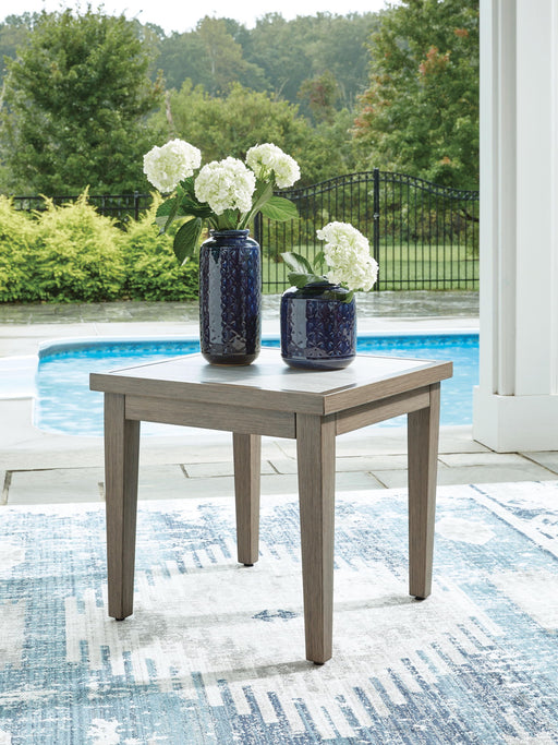 Signature Design by Ashley Rainier Ranch square end table in brown and beige wood finish, showcasing a modern square design.