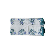 Set of four TOV Furniture Crissy cotton canvas printed napkins with blue cornflower design on soft fabric.