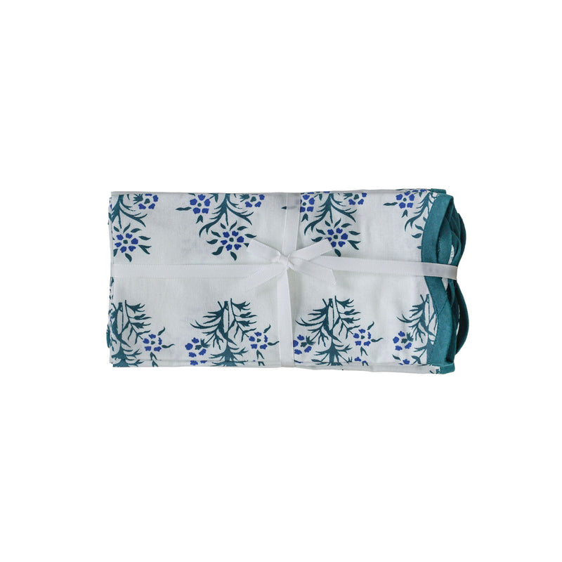 Set of four TOV Furniture Crissy cotton canvas printed napkins with blue cornflower design on soft fabric.