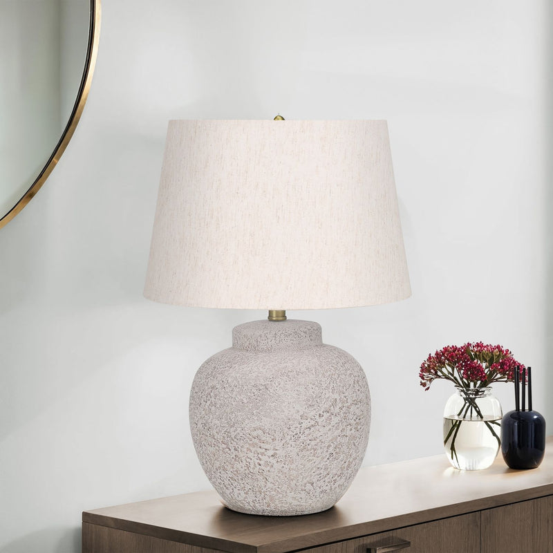 Modern concrete table lamp in cream color by 8th Street, featuring a sleek, minimalistic design for contemporary interiors.