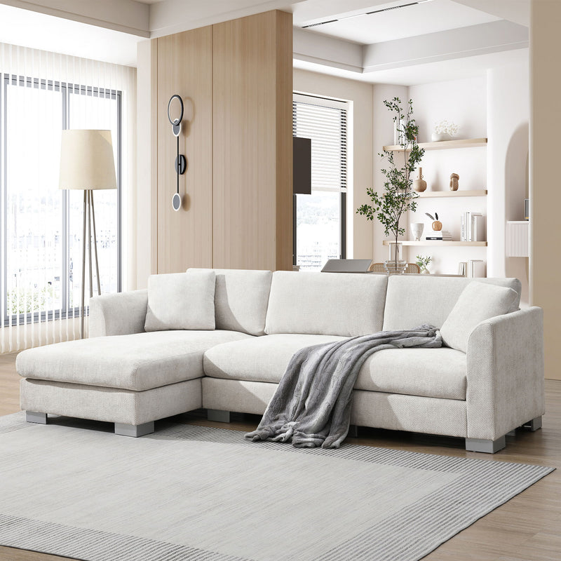 Luxe & Co. modern cloud L-shaped sectional sofa with oversized chaise, four seats, and two free pillows in a stylish living room setting