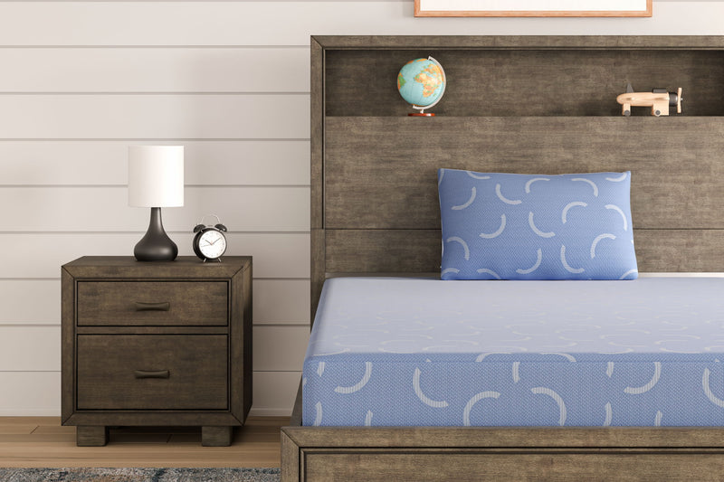 Blue twin size memory foam mattress and pillow set by Sierra Sleep® Ashley, featuring plush, supportive bedding for restful sleep.