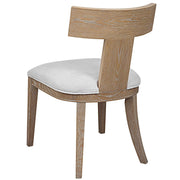 Uttermost Idris armless side chair with upholstered seat and wooden legs, modern design for living or dining spaces.