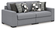 Benchcraft Bealton stationary sectional sofa with plush fabric upholstery and multiple seating sections in a modern living room