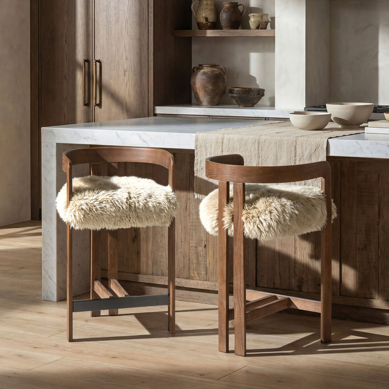 Jennifer Taylor Home Millwick low back counter stool with wooden legs and upholstered seat, designed for counter height seating.