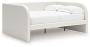 Signature Design by Ashley upholstered day bed with plush fabric and a modern frame, perfect for a stylish guest or lounging space.