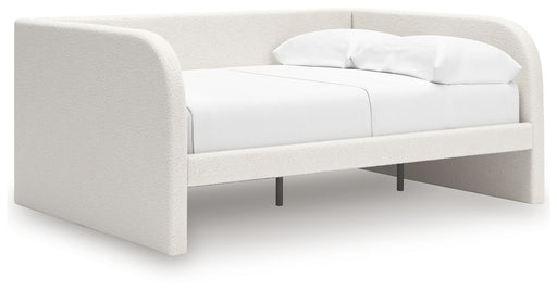 Signature Design by Ashley upholstered day bed with plush fabric and a modern frame, perfect for a stylish guest or lounging space.