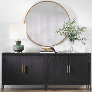 Round wall mirror by Uttermost featuring a sleek frame, ideal for modern home decor.