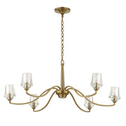 Uttermost Barcelona 6-light brass chandelier with gold finish and elegant design, hanging fixture with six glass shades.