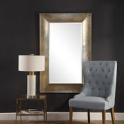 Large Valenton wall mirror by Uttermost featuring a champagne-colored frame with a sleek, modern design.