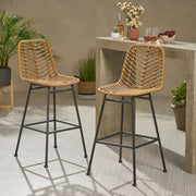 Set of two Noble House Sawtelle outdoor wicker barstools with armrests and beige cushions, designed for patio or outdoor use.