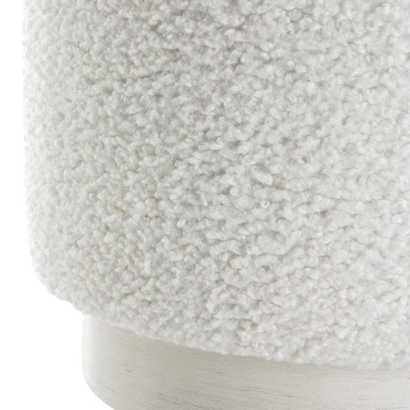 Uttermost Avila accent ottoman with plush fabric and wooden legs, versatile piece for living room or bedroom decor.