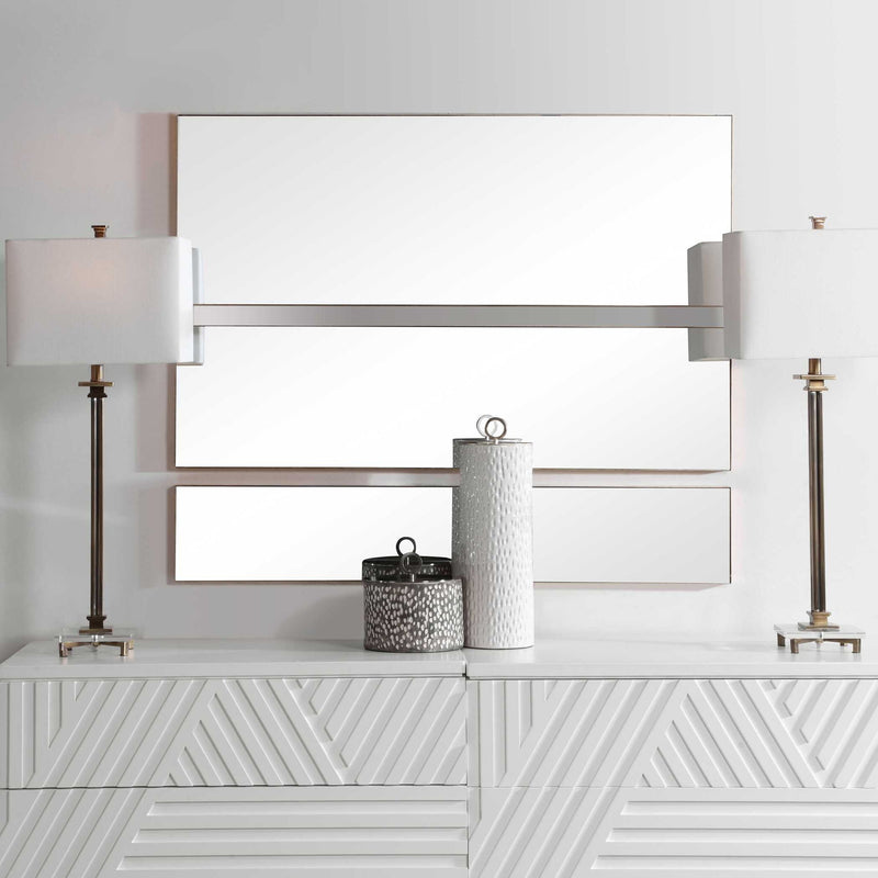 Set of three gold wall mirrors by Uttermost featuring elegant, round frames with reflective glass, ideal for modern interior decor.