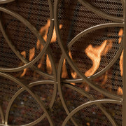 Noble House Thayer single panel iron fireplace screen with geometric design, featuring black metal framework and decorative pattern.
