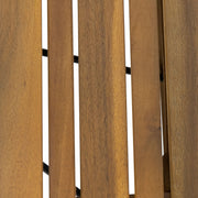 Noble House Temptation outdoor foldable side table with slat design, compact and portable for patio or balcony use.
