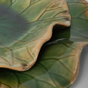 Set of three ceramic wall decor by Uttermost, featuring modern abstract designs for stylish interior wall decoration.