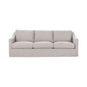 Classic Home Kipton upholstered stationary sofa with plush fabric and tufted back, stylishly displayed in a modern living room setting.
