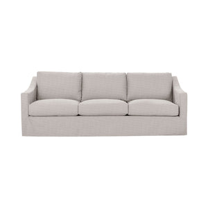 Classic Home Kipton upholstered stationary sofa with plush fabric and tufted back, stylishly displayed in a modern living room setting.