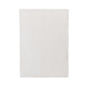 Classic Home Taiga throw blanket with soft, woven fabric and a cozy textured design, perfect for lounging and home decor.