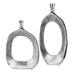 Pair of Pearl Silver aluminum vases from Uttermost, featuring sleek, modern design and smooth surface for decorative use.