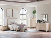 Signature Design by Ashley Cadmori six drawer dresser with sleek wood finish and modern hardware for stylish bedroom storage.