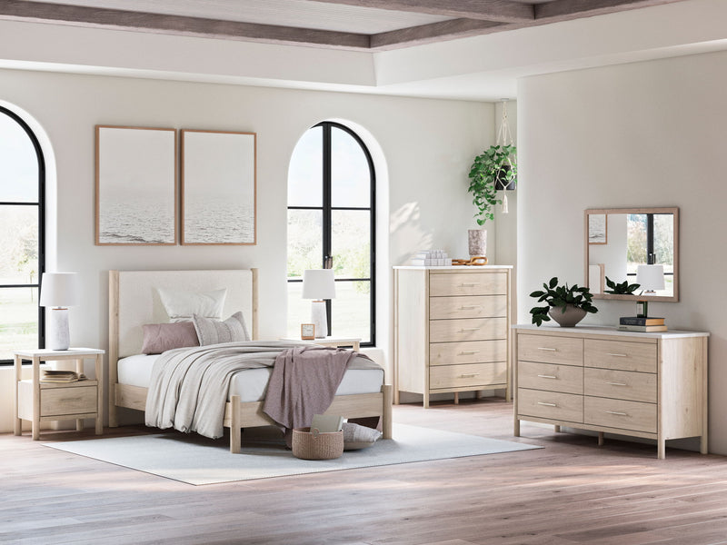 Signature Design by Ashley Cadmori six drawer dresser with sleek wood finish and modern hardware for stylish bedroom storage.