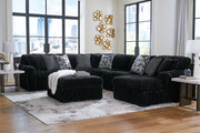 Signature Design by Ashley Midnight-Madness 4-piece sectional living room set with plush cushions and modern design.