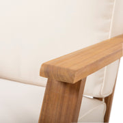 Noble House outdoor patio lounge arm chair with cushioned seat and backrest, ideal for outdoor relaxation and seating.
