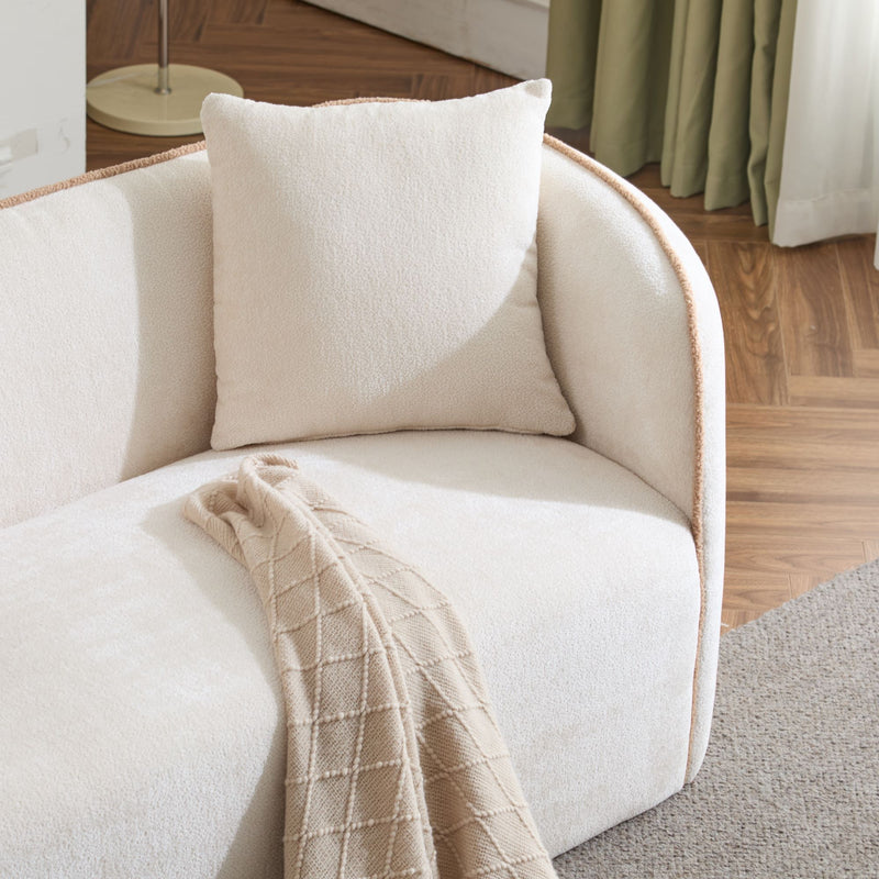 Noble House Coral 3-seater curved stationary sofa with plush cushions and modern design in a stylish living room setting.