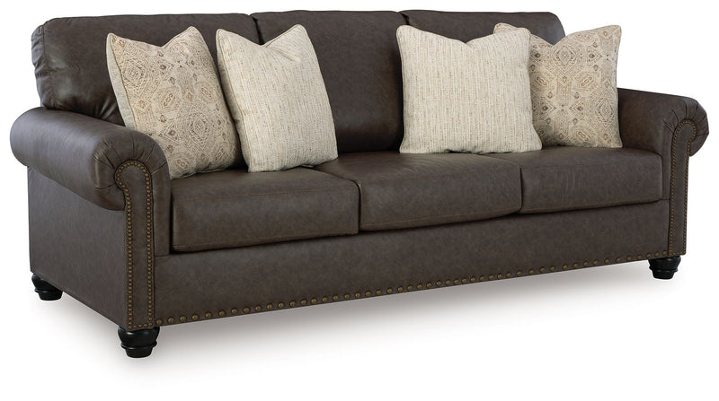 Benchcraft Roxmere living room set with stationary chair and matching ottoman, featuring plush upholstery and modern design.