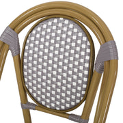 Noble House outdoor rattan and aluminum French bistro chair set with woven seats and curved armrests on a patio.