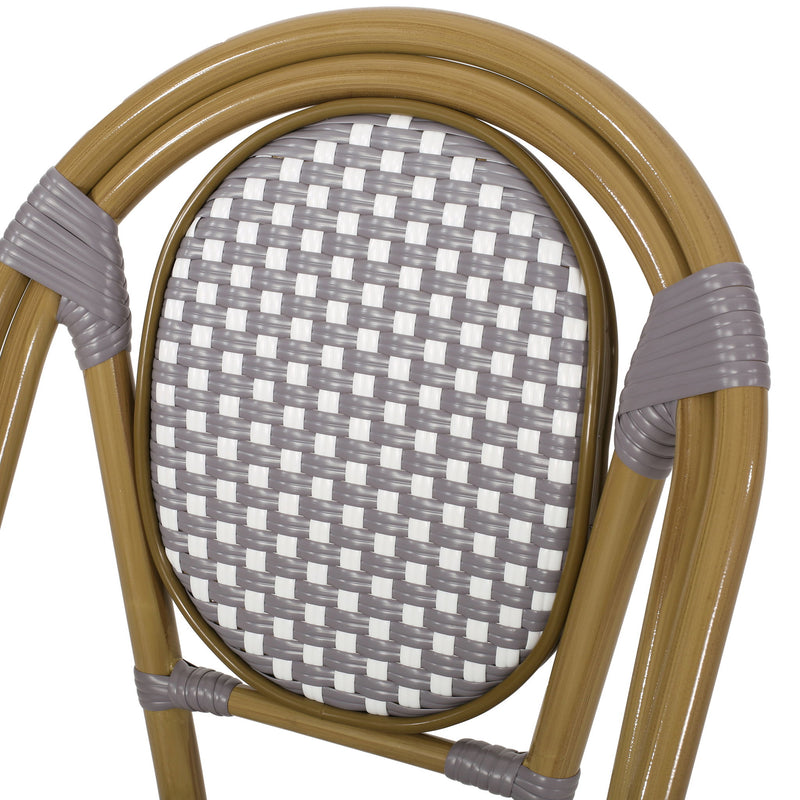 Noble House outdoor rattan and aluminum French bistro chair set with woven seats and curved armrests on a patio.
