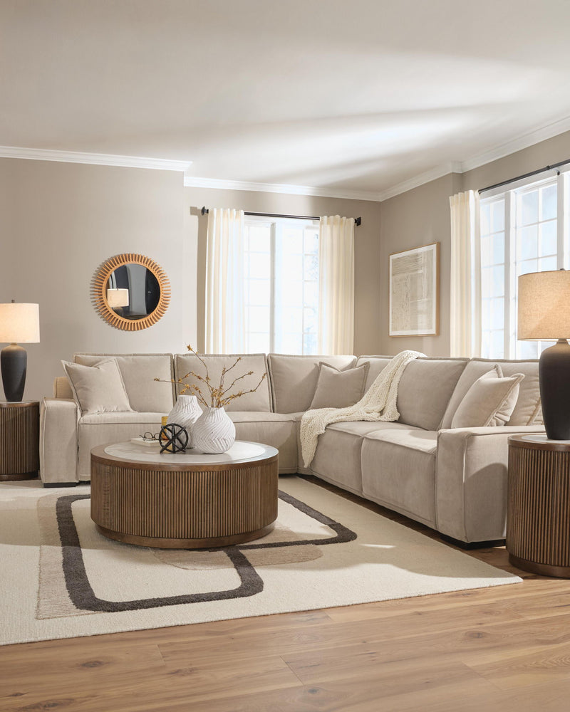 Benchcraft® Carceri reclining sectional sofa with plush cushions and reclining features in a modern living room setting.