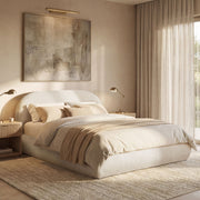 Jennifer Taylor Home Archie Puffy Grounded upholstered platform bed with plush headboard and sleek frame in a modern bedroom setting.