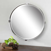 Uttermost Tazlina round wall mirror with brushed nickel finish, sleek modern design, and reflective glass surface.