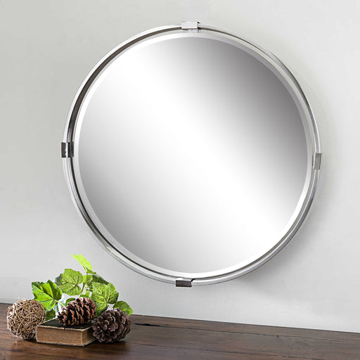 Uttermost Tazlina round wall mirror with brushed nickel finish, sleek modern design, and reflective glass surface.