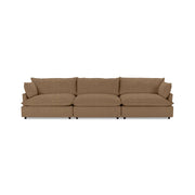 Classic Home Caplan modular sectional sofa with plush cushions and fabric upholstery, shown in a modern living room setting.