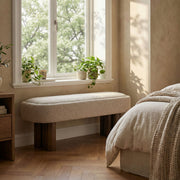 Indoor upholstered dining bench by Noble House with cushioned seat and wooden legs, ideal for modern dining rooms.