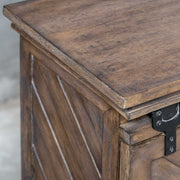 Uttermost Primalia barn door media console in light brown wood with sliding barn doors and storage compartments.
