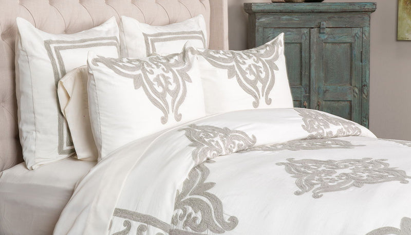 Ivory Patrina 3-piece queen bedding duvet set from Classic Home, includes duvet cover and matching pillow shams.