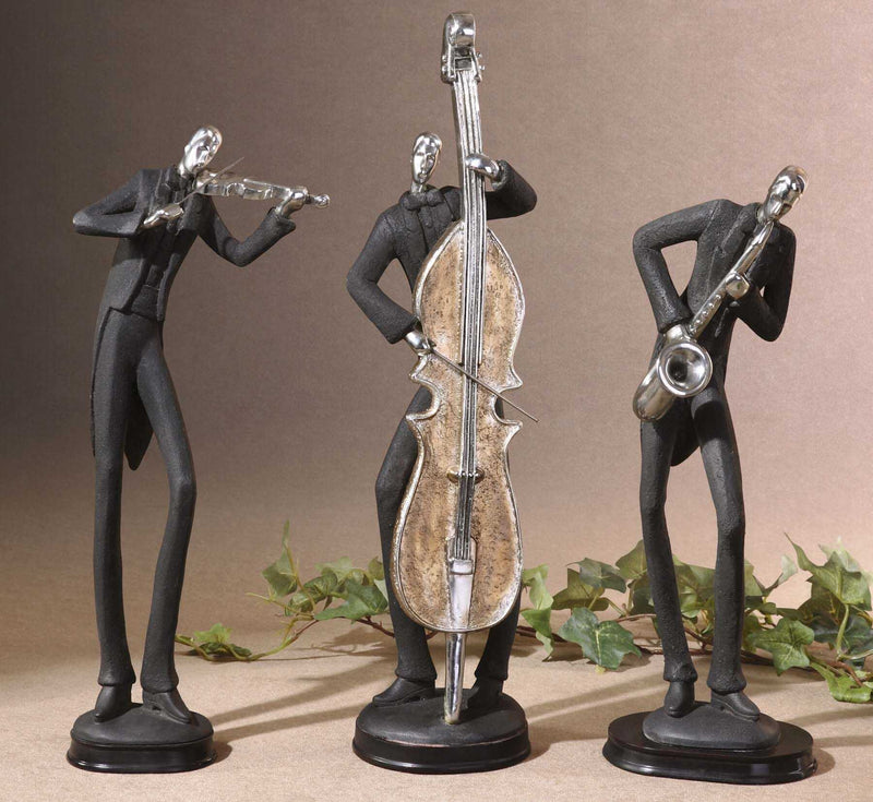 Set of three black musician decorative figurines by Uttermost, elegant sculptures depicting musicians in artistic poses.
