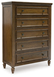 Benchcraft Sturlayne 6-piece panel bedroom set with matching bed frame, dresser, mirror, and nightstands in a modern bedroom layout.